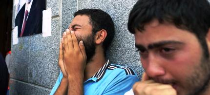 Egyptians mourned supporters of ousted President Mohammed Morsi who were killed in overnight clashes with security forces in Cairo. (photo: Hassam Ammar/AP)