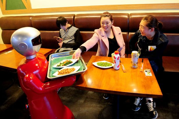 A battery-powered robot serves dishes up to 8 hour a day in a restaurant in Shenyang, capital of northeast China's Liaoning Province A battery-powered robot serves dishes up to 8 hour a day in a restaurant in Shenyang, capital of northeast China's Liaoning Province