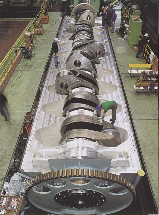 The crankshaft of worlds biggest engine the crank shaft translates reciprocating linear piston motion into rotation. Compare its size with the size of the man. The crankshaft of worlds biggest engine the crank shaft translates reciprocating linear piston motion into rotation. Compare its size with the size of the man.